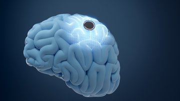 Abstrakte Darstellung eines Gehirns, auf dem sich ein kleiner, runder Chip befindet