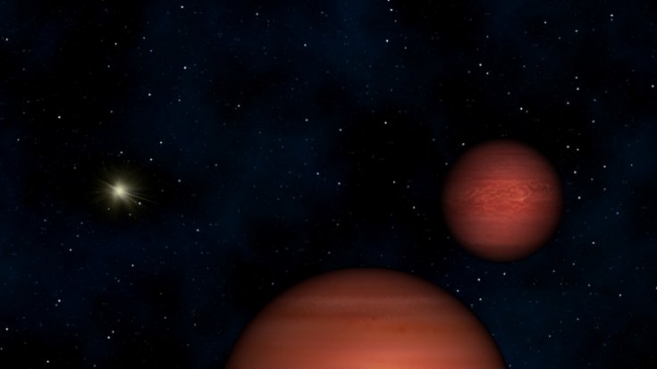 Grafik von drei verschieden großen Sternen vor schwarzem Hintergrund