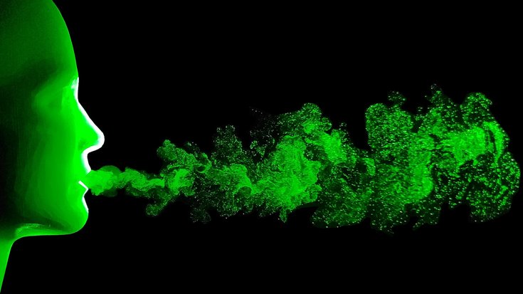 Grafik: Ein grüner Kopf atmet nach rechts aus, sein grüner Atem wird wolkenartig vor schwarzem Hintergrund dargestellt