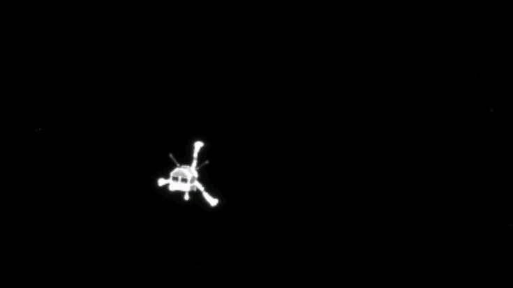 Ein unscharfen, schwarz-weißes Bild eines kleinen Raumfahrzeugs mit drei ausgestreckten Beinen.