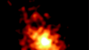 Ausgedehnte, diffuse Strahlungsquelle als helle Region vor einem schwarzen Hintergrund.