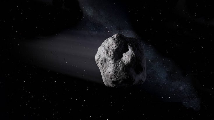 Dunkler Asteroid vor Sternenhintergrund