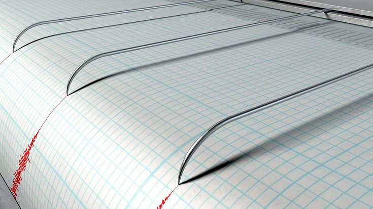Seismograf zeichnet Zitterlinien auf Papier.