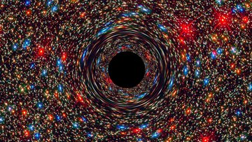 Im Zentrum einer Galaxie mit zahlreichen bunten Sternen und Himmelskörpern befindet sich ein kreisrundes Schwarzes Loch: Die Farbe stellt den Ereignishorizont dar, den keinerlei Materie oder Licht wieder überqueren kann, sobald sie ihn passiert haben.