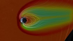 Schematische Darstellung der Erde im All, auf die ein Sonnensturm strifft und mit ihm hochenergetischer Partikelstrom, der durch Linien dargestellt ist. 