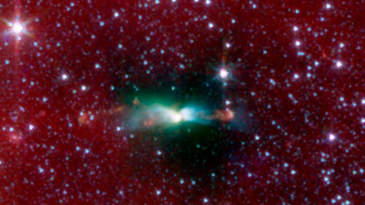Junger Stern in Lynds 483 | Bildquelle: NASA/JPL-Caltech/J.Tobin (University of Michigan) Stern in einer ausgedehnten leuchtenden Struktur