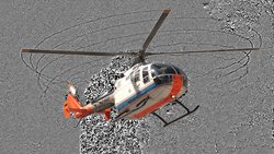 Ein Hubschrauber vor felsigem, feinkörnigen Hintergrund. Die Wirbel an den Rotorblattspitzen und am Heckrotor sind als dunkle, spiralförmige Linien sichtbar. Die Abgasstrahlen erscheinen als verrauschte Fläche hinter dem Hubschrauber.