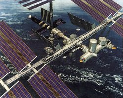 Fotomontage eines Modells der Raumstation ISS mit verschiedenen angedockten Modulen im All oberhalb der Erde.