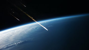Blick vom Weltraum auf die Erde; Lichtspuren zeigen Gesteinsbrocken an, die sich der Erdatmosphäre nähern