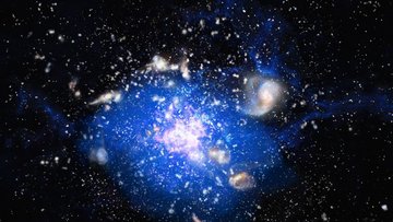 Große, in eine leuchtende Wolke eingebettete Galaxie, umgeben von vielen kleinen Galaxien.