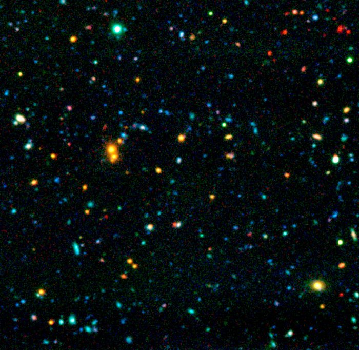 Chandra Deep Field Himmelsaufnahme mit zahllosen meist punktförmigen Objekten in vielen verschiedenen Farben.
