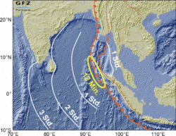 Landkarte des nordöstlichen Indischen Ozeans mit Indonesien und Indien. Gezackte Linie markiert Bruch in der Erdkruste. Außerdem vier konzentrische Linien um das Meeresgebiet nordwestlich von Sumatra, beschriftet mit "12 Minuten", "1 Stunde", "2 Stunden", "3 Stunden".