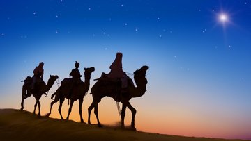 Illustration. Heller Stern am Himmel, im Vordergrund drei Reiter auf Kamelen.