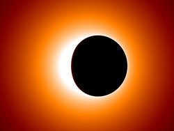 Schwarzer, fast kreisförmiger Fleck vor einem hellen Hintergrund in gelb und orange.