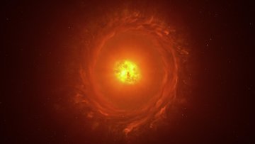 Leuchtender Kreis im Zentrum umgeben von einem schwächer leuchtenden Ring auf dunklem Hintergrund.