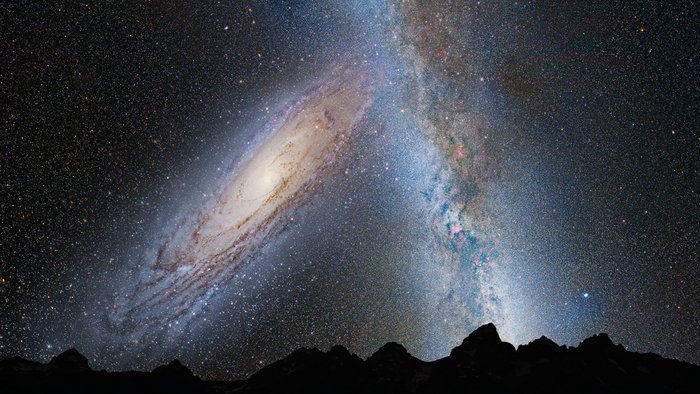 Vermutlich werden die Milchstraße und die Andromedagalaxie in einigen Milliarden Jahren kollidieren und miteinander zu einer elliptischen Galaxie verschmelzen. Diese Illustration zeigt das Bild, das sich am irdischen Himmel in diesem Fall zeigen könnte: Links ist die Andromedagalaxie zu sehen, eine Spiralgalaxie, die bereits anfängt, die Milchstraße (rechts) durch ihre Schwerkraft zu beeinflussen.