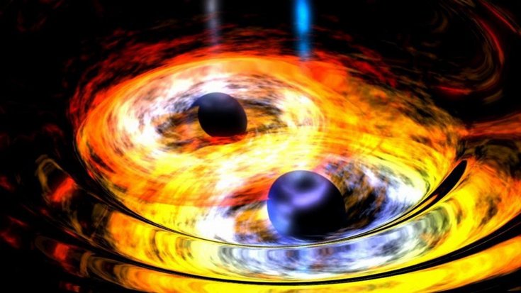 Zwei dunkle, kugelförmige Objekte, umgeben von wirbelnder leuchtender Materie.