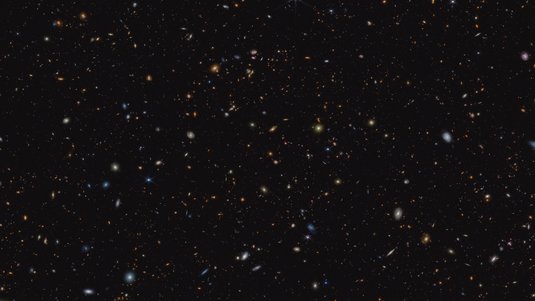 Viele helle Punkte verschiedener Größen auf dunklem Hintergrund