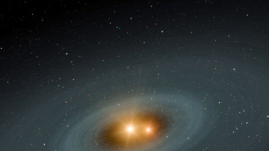 Zwei helle Sterne umkreisen sich dicht, während sie von einem ringförmigen Nebel umgeben sind.