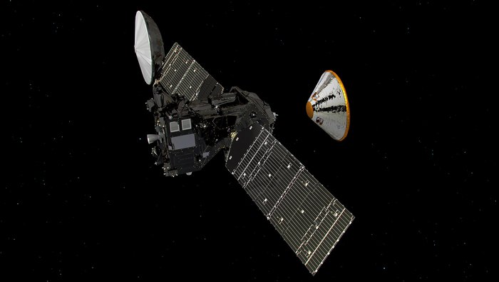 Illustration der Raumsonden Trace Gas Orbiter und Schiaparelli Eine rechteckige Raumsonde mit einer großen Parabolantenne und zwei großen Solarpanels. Davor schwebend eine konusförmige Sonde mit gänzender Verkleidung.